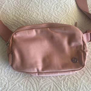 Like New - used twice, lululemon everywhere belt bag pink pastel